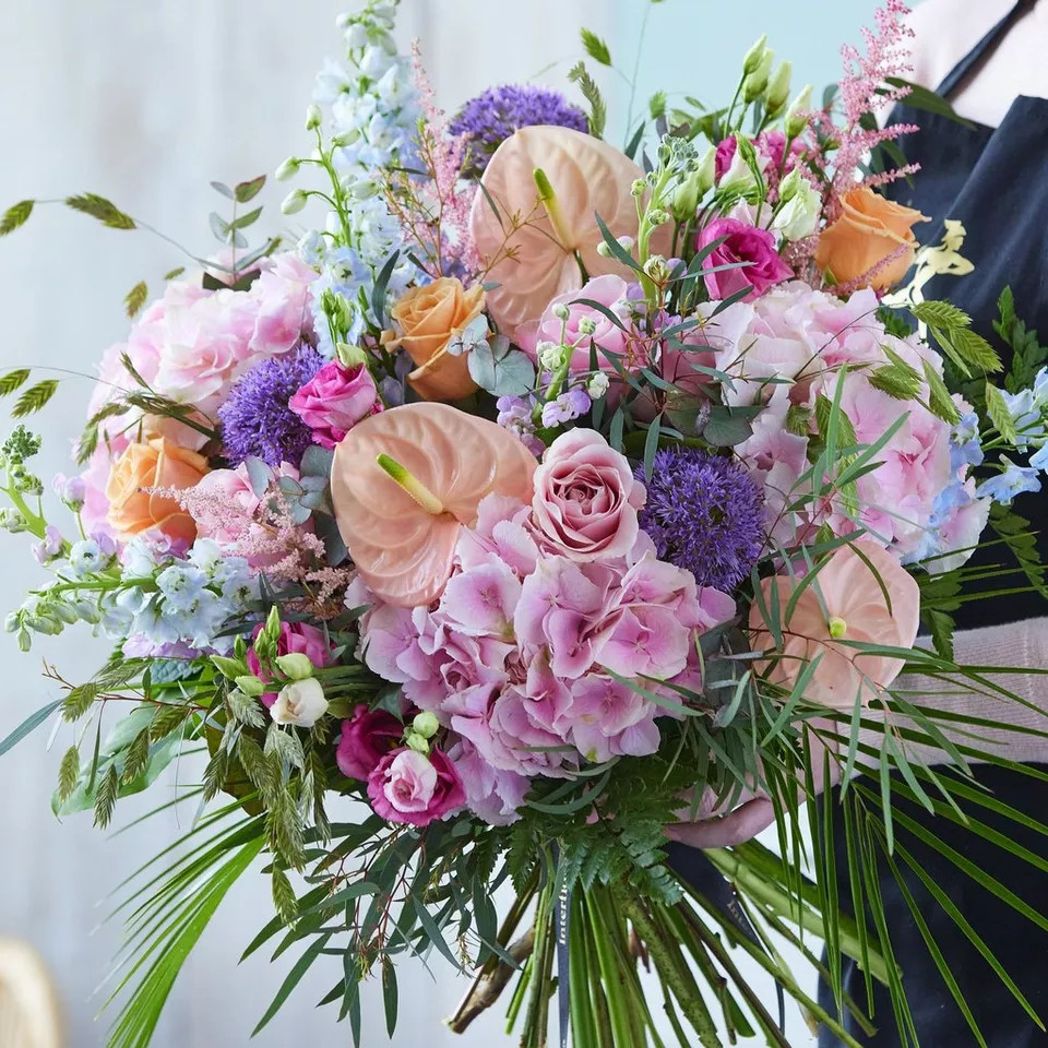 Hand-tied bouquet made with beautiful fresh flowers